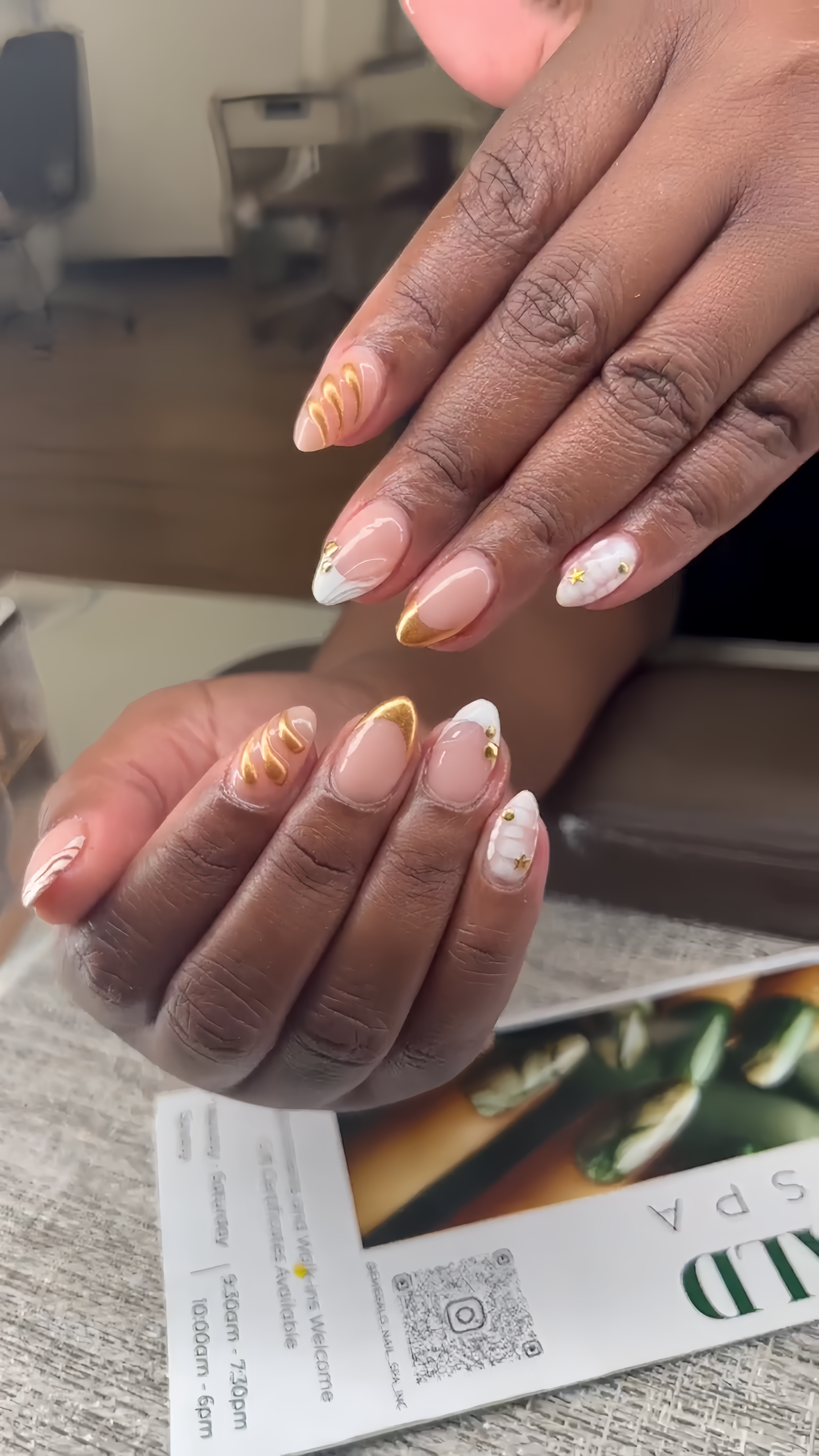 Gold swirl and marble nail art by Emerald Nails and Spa