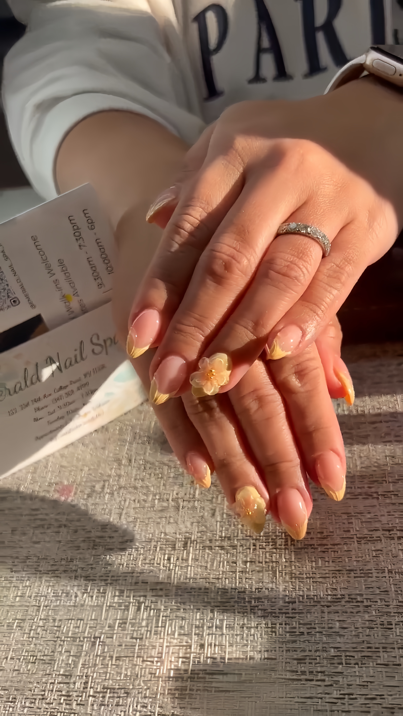 Detailed nail art with gemstone accents